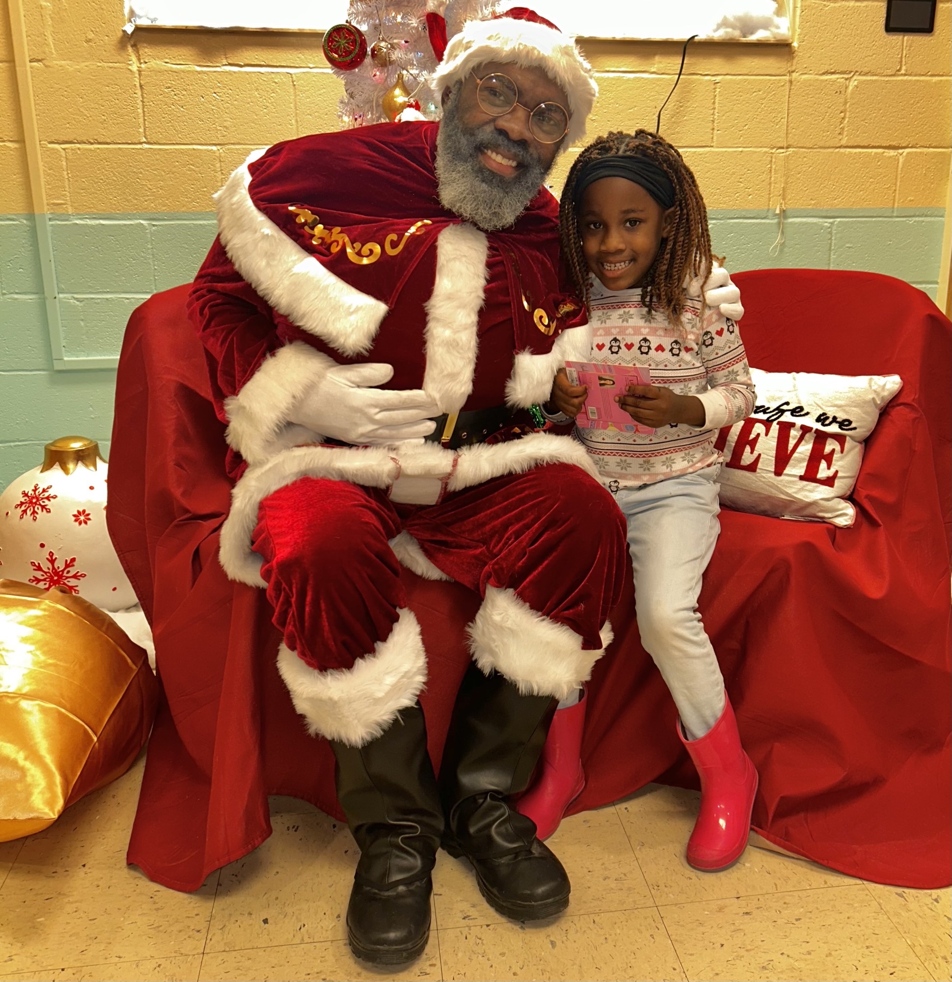 santa sitting with an excited young lady