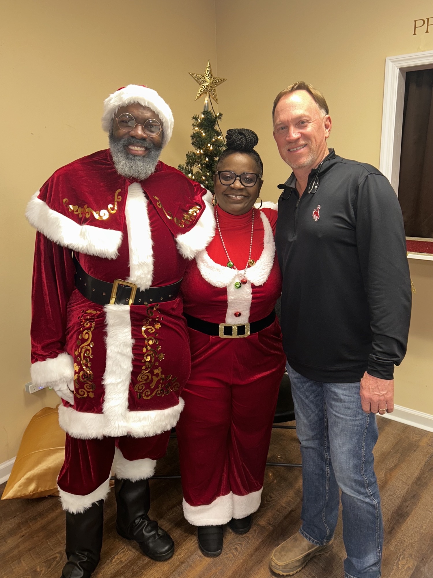 santa with mrs claus and another gentleman