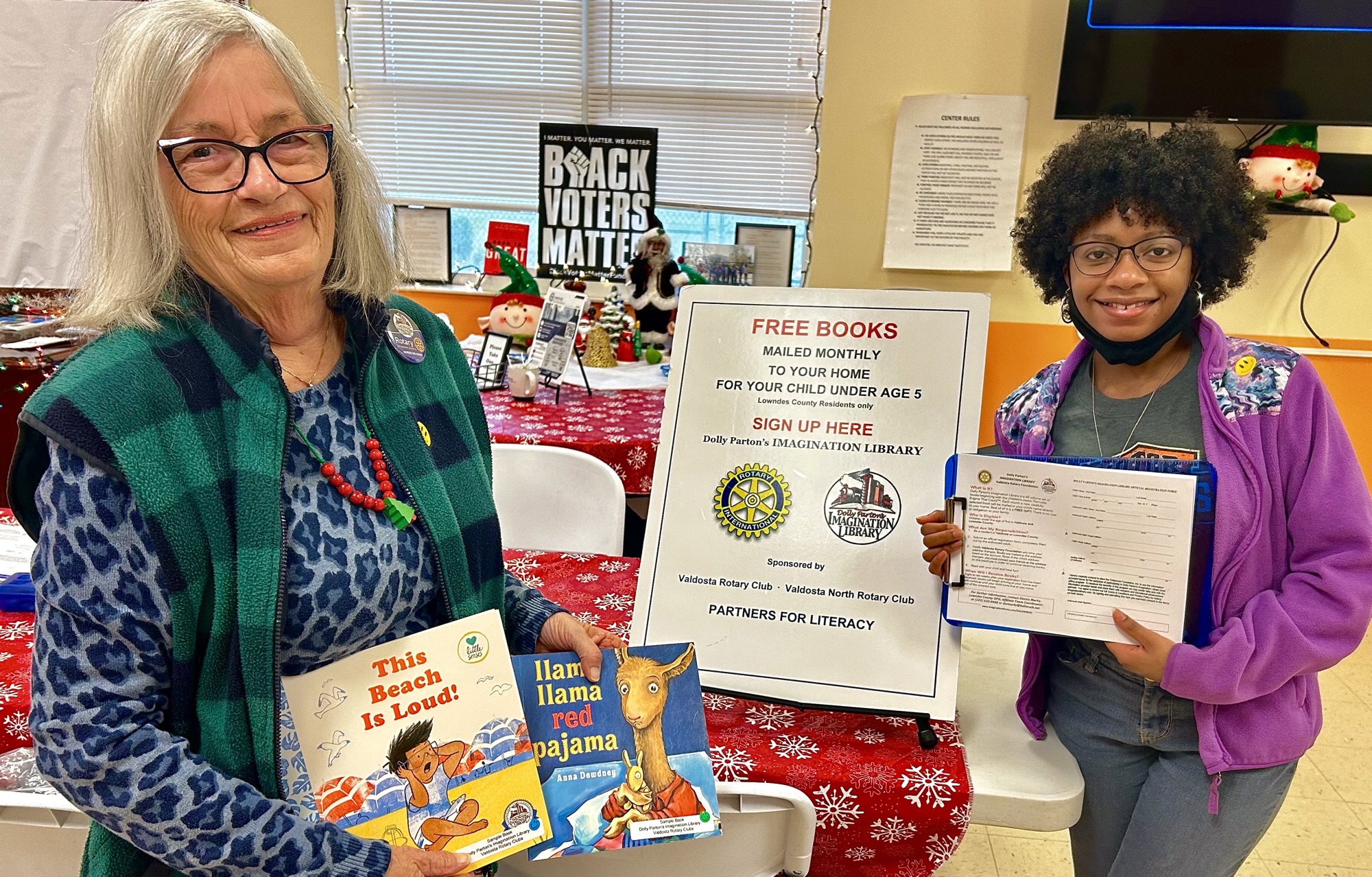 women standing at free book drive